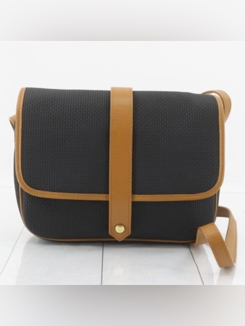 AUTHENTIC Yves Saint Laurent woven black and
tan shoulder bag